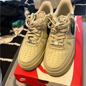 Nike Cream Sneakers with Black Logo